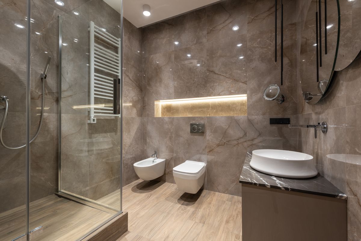 Wall-hung toilet and bidet in a Dallas, TX bathroom