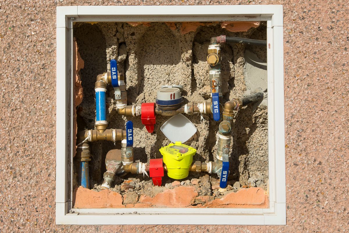 Water valves and pipes serving a toilet in a Dallas, TX home